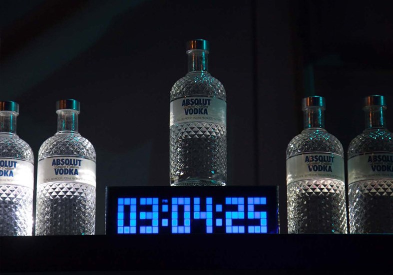 Absolut vodka bottle and clock