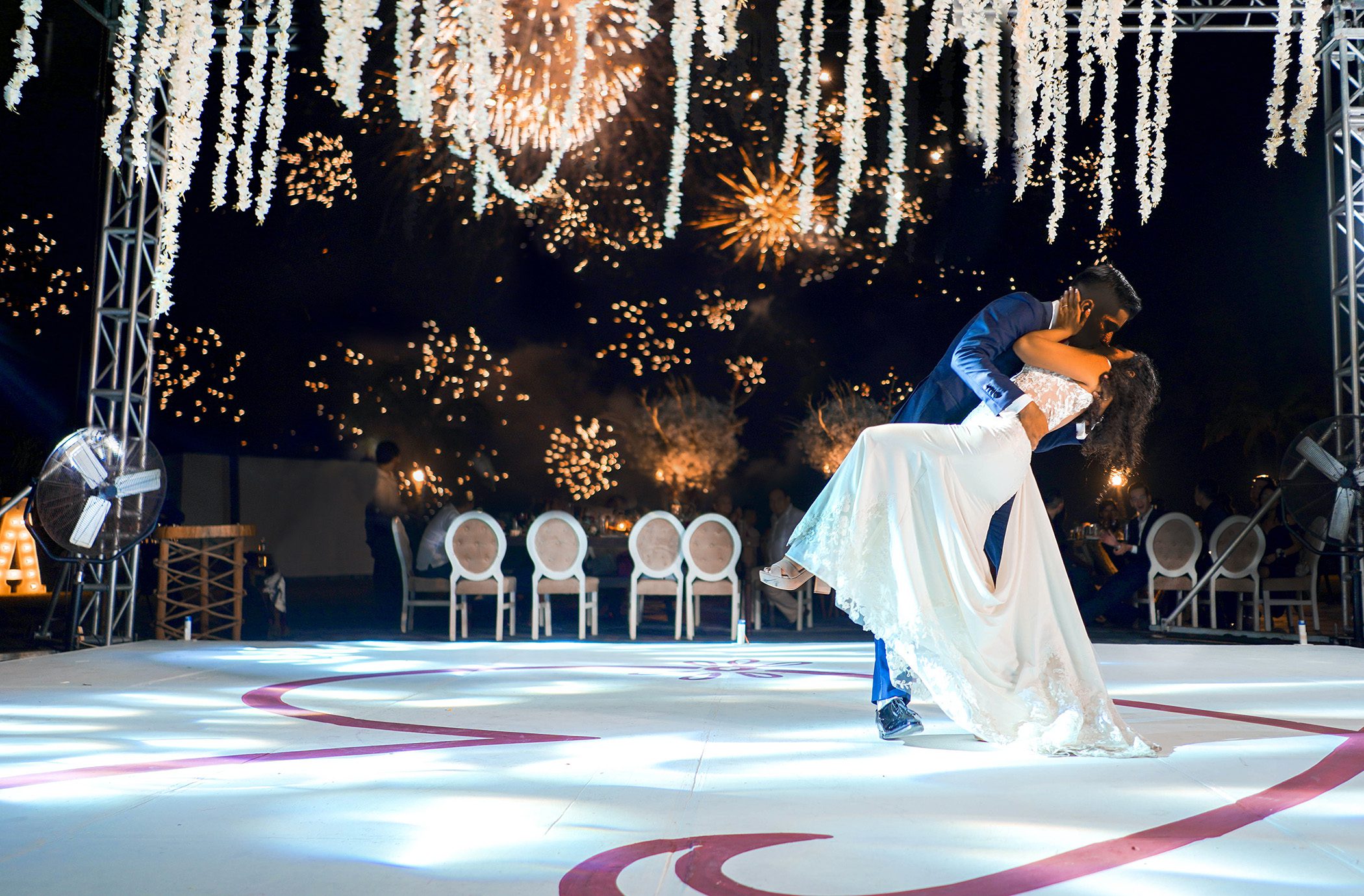 Wedding couple on stage with lighting and fireworks